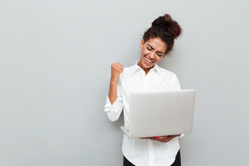 cheerful-business-woman-make-winner-gesture-1